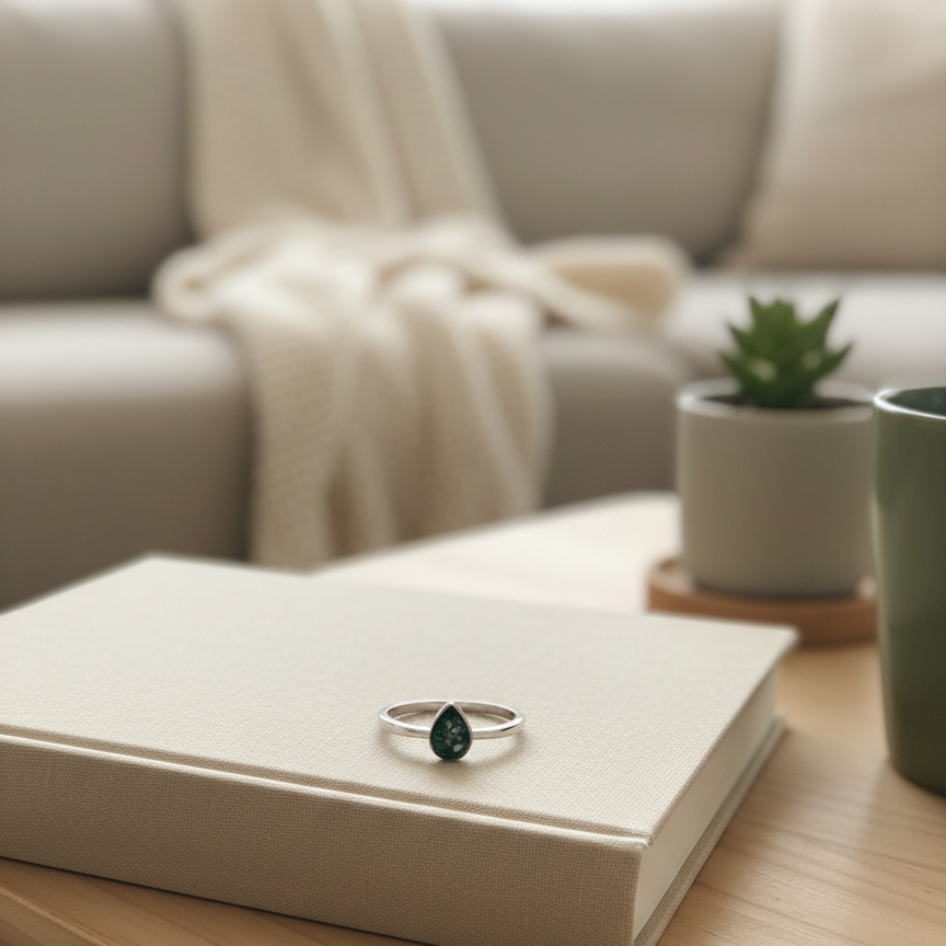 Ring on a book on a wooden table with a blurred living room background